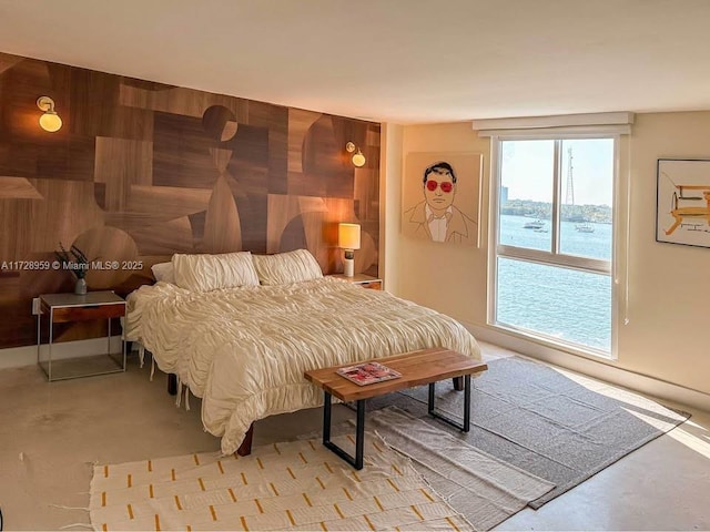 bedroom featuring a water view