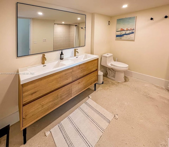 bathroom with vanity, a shower with shower curtain, and toilet