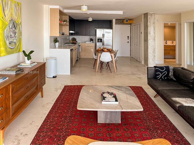 living room featuring sink