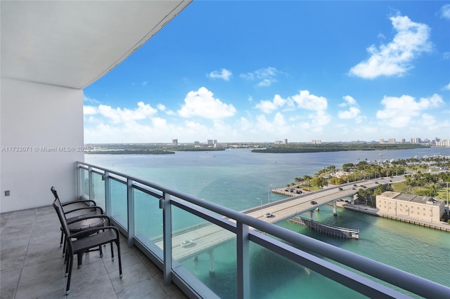 balcony featuring a water view