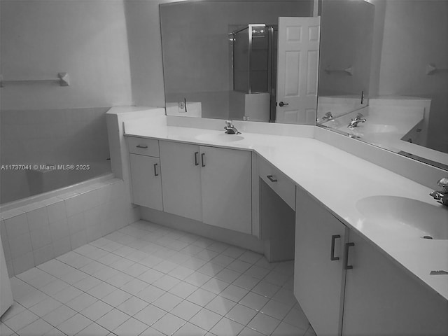 bathroom with vanity, independent shower and bath, and tile patterned flooring