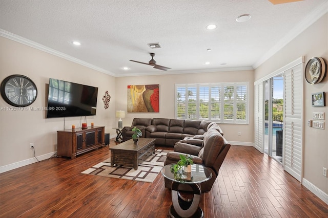 living area featuring baseboards, a textured ceiling, ornamental molding, and dark wood-style flooring