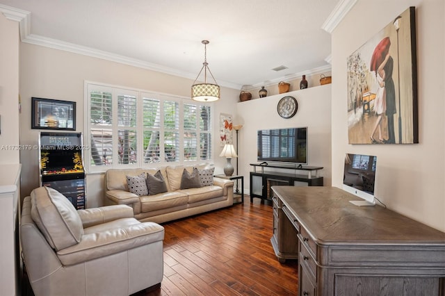 living room featuring dark wood-style floors, visible vents, and crown molding