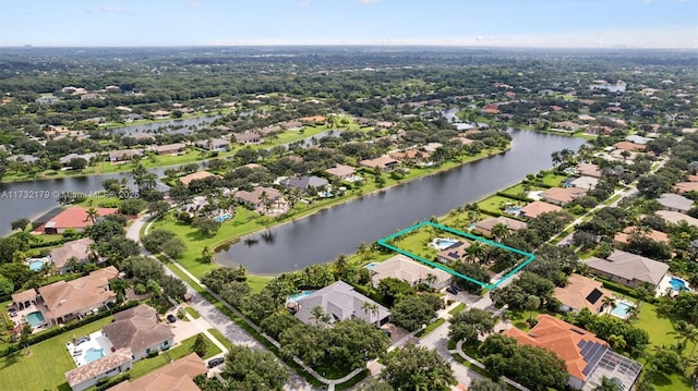 birds eye view of property featuring a residential view and a water view