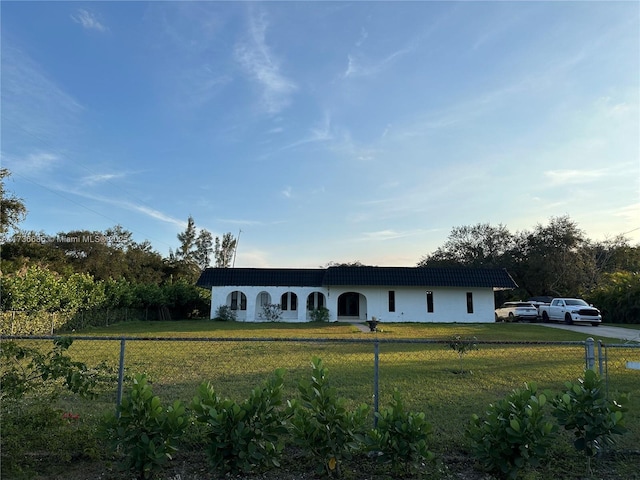 view of front of property with a front lawn