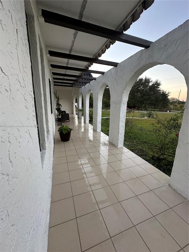 view of patio terrace at dusk