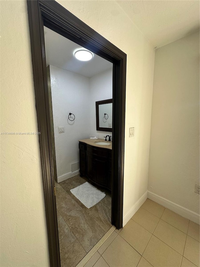 bathroom with vanity and tile patterned flooring