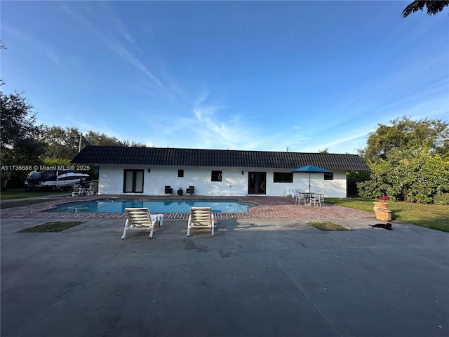 back of property featuring a patio