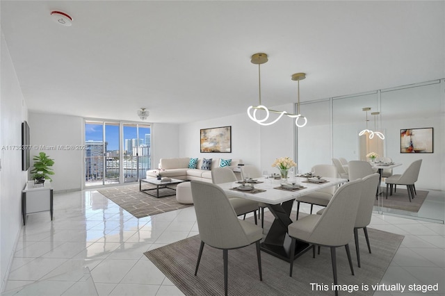 tiled dining room featuring expansive windows