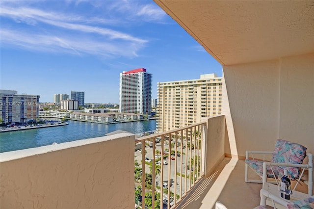 balcony featuring a water view