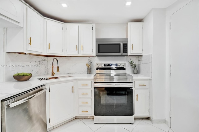 kitchen featuring white cabinetry, stainless steel appliances, and sink