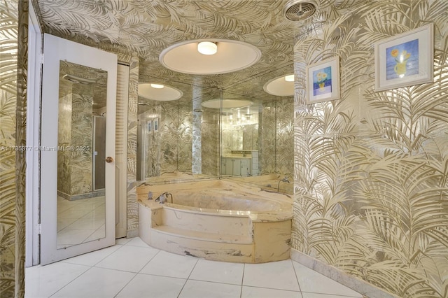 bathroom featuring a bath and tile patterned floors