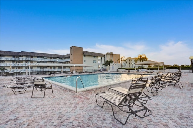 view of swimming pool featuring a patio