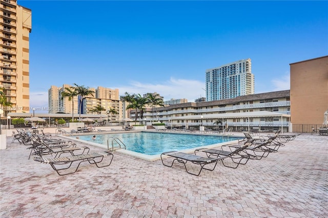 view of swimming pool featuring a patio area