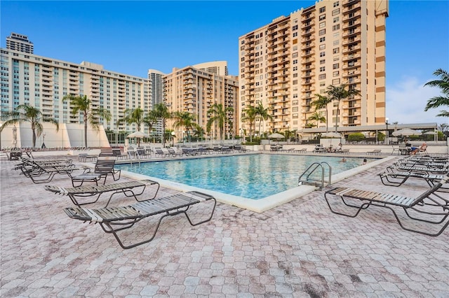 view of swimming pool featuring a patio