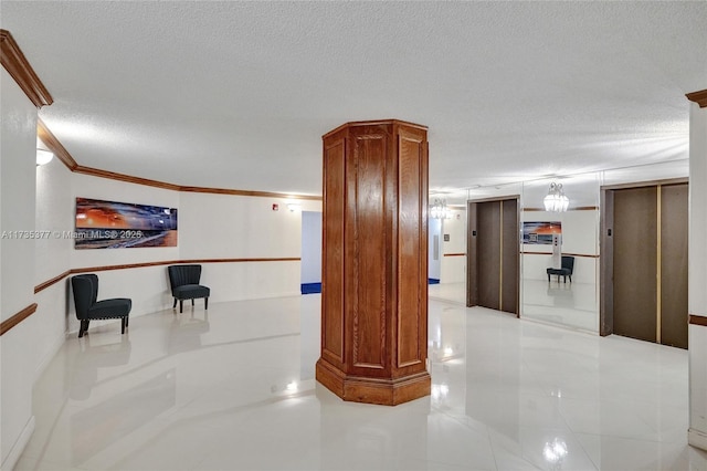 hallway featuring a textured ceiling, ornamental molding, and elevator