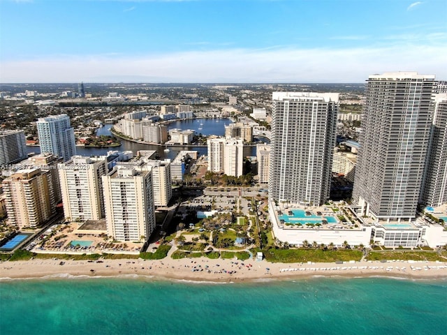 aerial view featuring a water view and a view of the beach