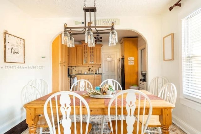 dining room with a textured ceiling