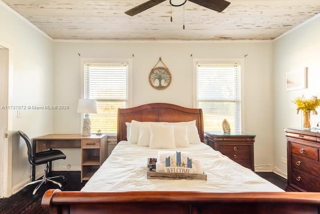 bedroom featuring crown molding, ceiling fan, and dark hardwood / wood-style flooring