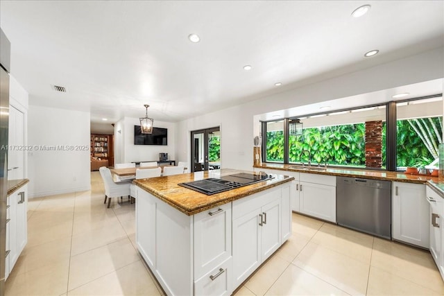 kitchen with sink, white cabinetry, a center island, black electric cooktop, and stainless steel dishwasher