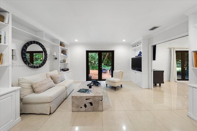 living room with light tile patterned flooring, built in features, crown molding, and french doors