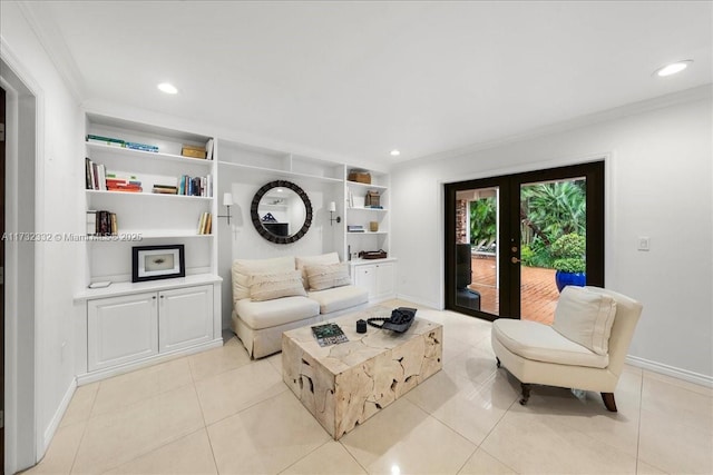 tiled living room featuring built in shelves, ornamental molding, and french doors