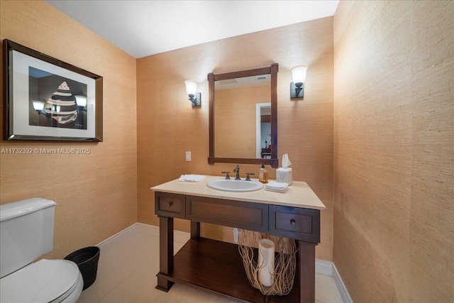 bathroom featuring vanity, toilet, and tile patterned flooring