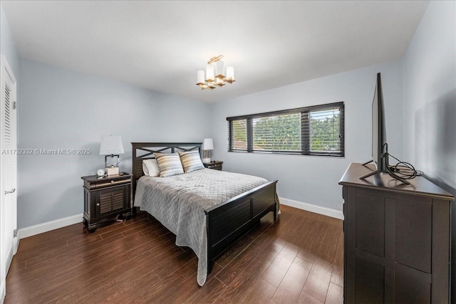 bedroom with dark hardwood / wood-style flooring