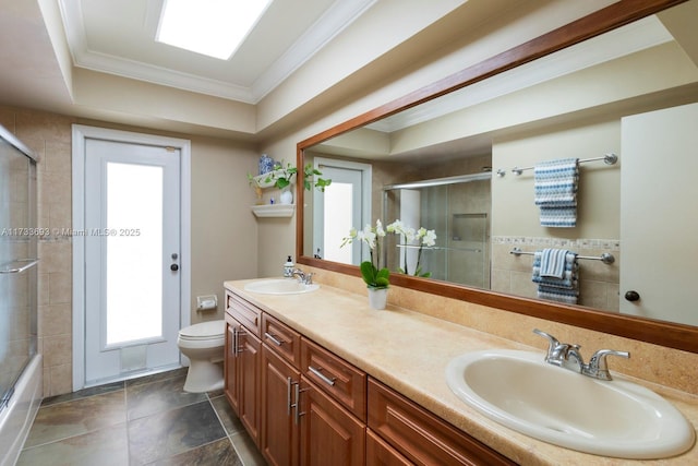 7420 SW 145th Ter, Palmetto Bay, FL 33158 - full bathroom featuring vanity, combined bath / shower with glass door, ornamental molding, and toilet