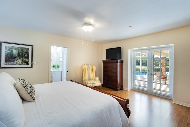 7420 SW 145th Ter, Palmetto Bay, FL 33158 - bedroom with light hardwood / wood-style flooring, access to outside, and french doors