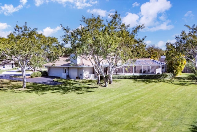 7420 SW 145th Ter, Palmetto Bay, FL 33158 - view of yard featuring a garage and a lanai