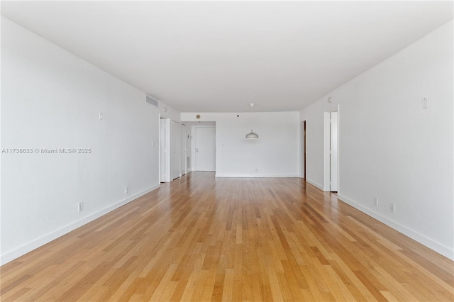 unfurnished room featuring light wood-type flooring