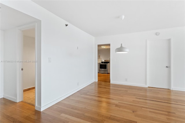 unfurnished room featuring light hardwood / wood-style floors