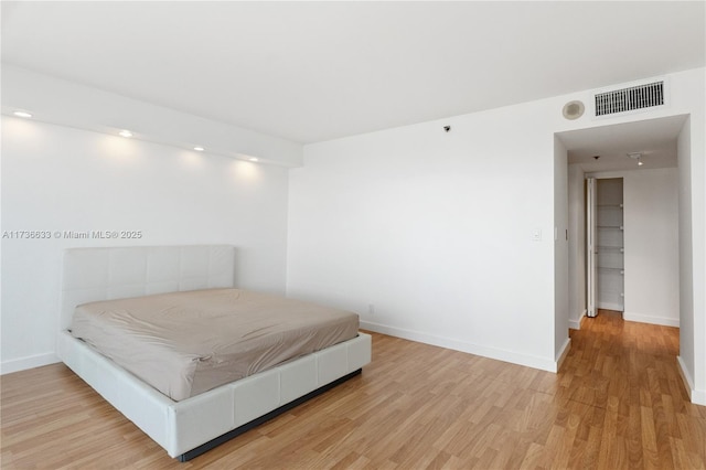 bedroom with light hardwood / wood-style floors