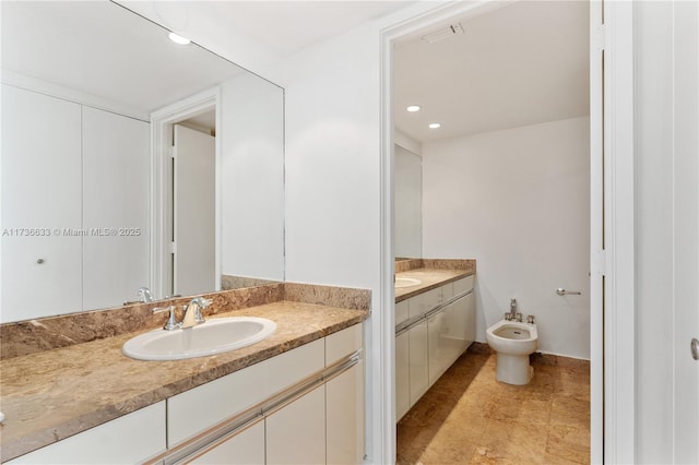 bathroom featuring a bidet and vanity