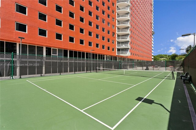 view of sport court featuring basketball hoop