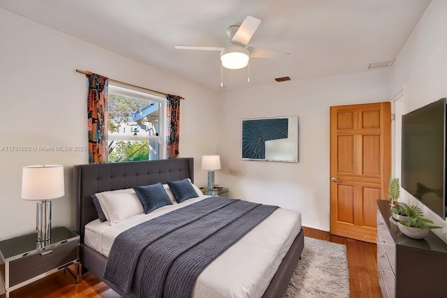 bedroom featuring hardwood / wood-style flooring and ceiling fan