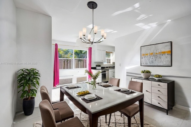 dining area featuring a chandelier