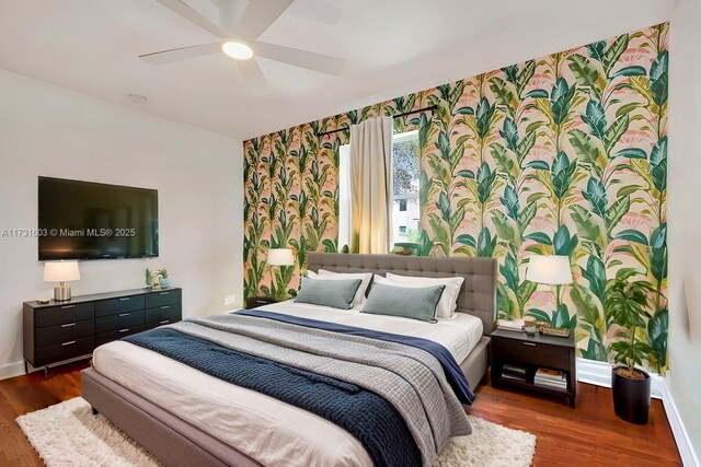 bedroom with dark wood-type flooring and ceiling fan