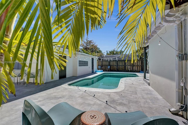 view of pool featuring a patio, a fenced backyard, and a fenced in pool