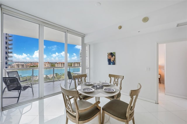 50 S Pointe Dr Unit 1704, Miami Beach, FL 33139 - dining room with expansive windows and light tile patterned floors
