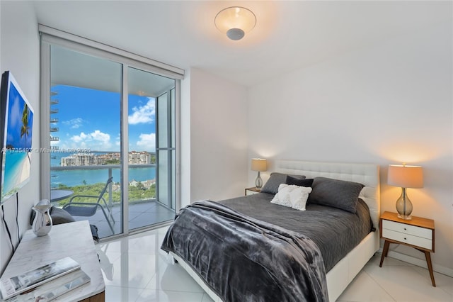 bedroom with floor to ceiling windows and access to outside