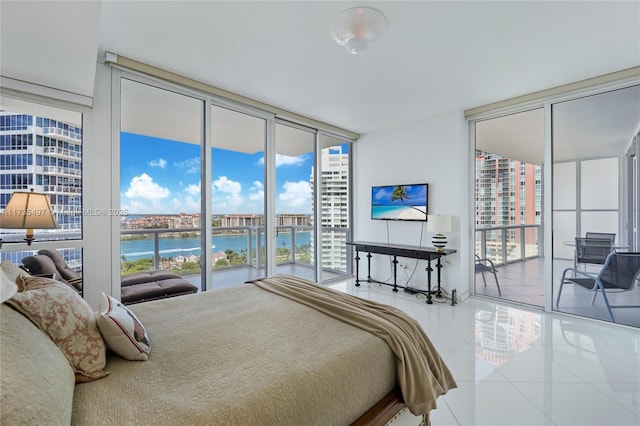 50 S Pointe Dr Unit 1704, Miami Beach, FL 33139 - bedroom with expansive windows, access to exterior, tile patterned flooring, and multiple windows