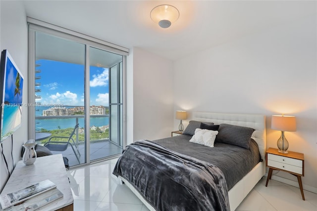 50 S Pointe Dr Unit 1704, Miami Beach, FL 33139 - bedroom with expansive windows, access to exterior, and light tile patterned floors