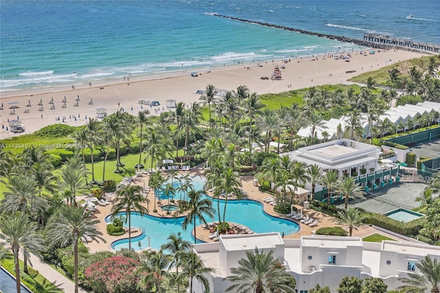 drone / aerial view with a water view and a view of the beach