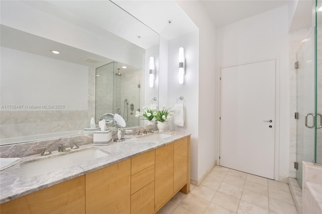 bathroom featuring vanity, an enclosed shower, and tile patterned floors