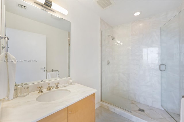 bathroom with vanity and walk in shower