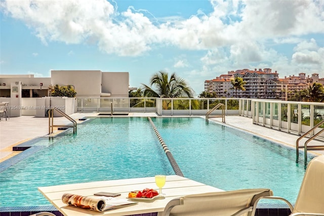 view of swimming pool featuring a patio