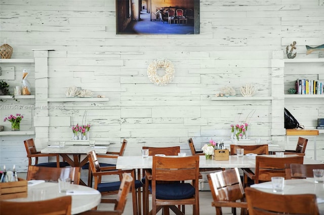 dining area with wood walls