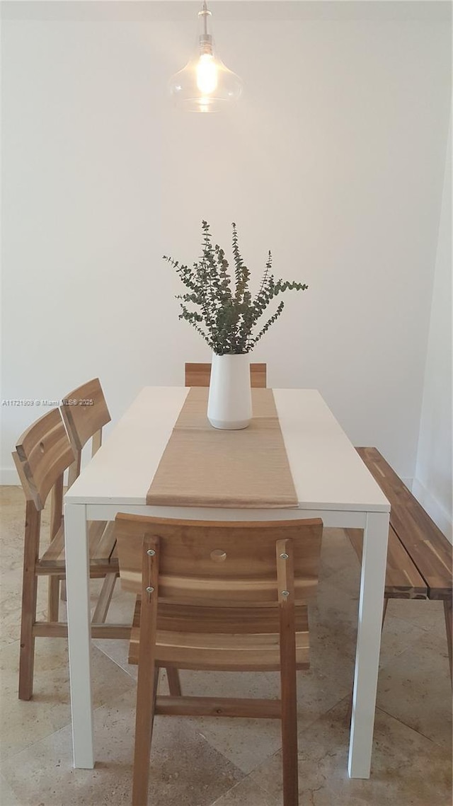 dining space with baseboards